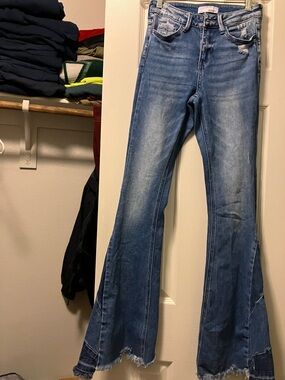 Vervet Distressed Medium Blue Flare Jeans with Frayed Hem Detail